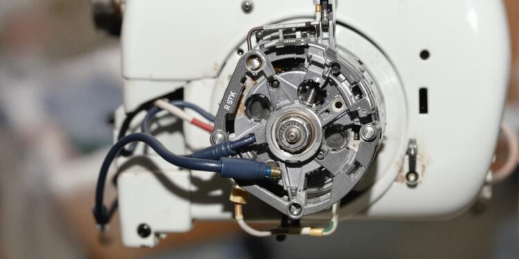 Close-up of a sewing machine motor and gears.