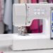 Modern computerized sewing machine with colorful fabrics.