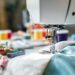 Close-up of a sewing machine with colorful threads.