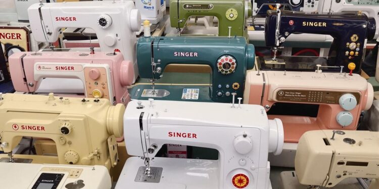 Various Singer sewing machines in a colorful arrangement.