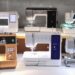 Various business sewing machines on a well-lit table.